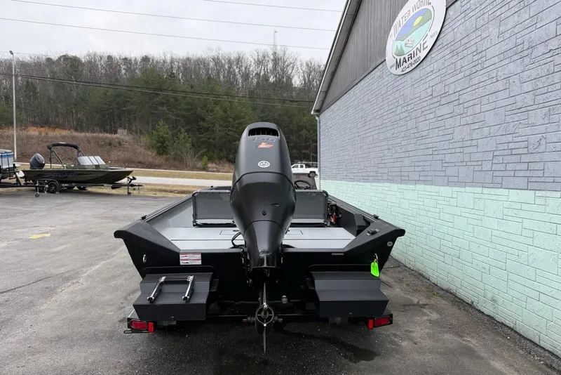 Slide: The Image of 2026 SeaArk Shadow 20 boat parked outside Water World Marine dealership. - 5