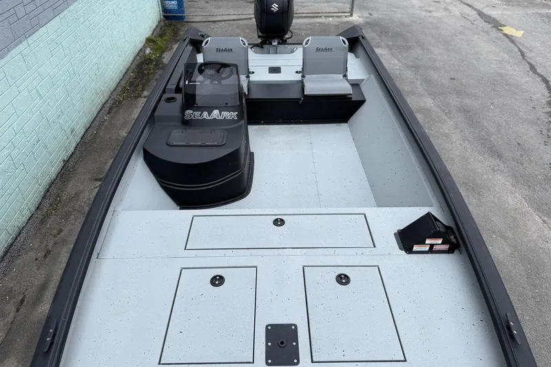 Slide: The Image of 2026 SeaArk Shadow 20 boat interior with seating and storage compartments. - 9
