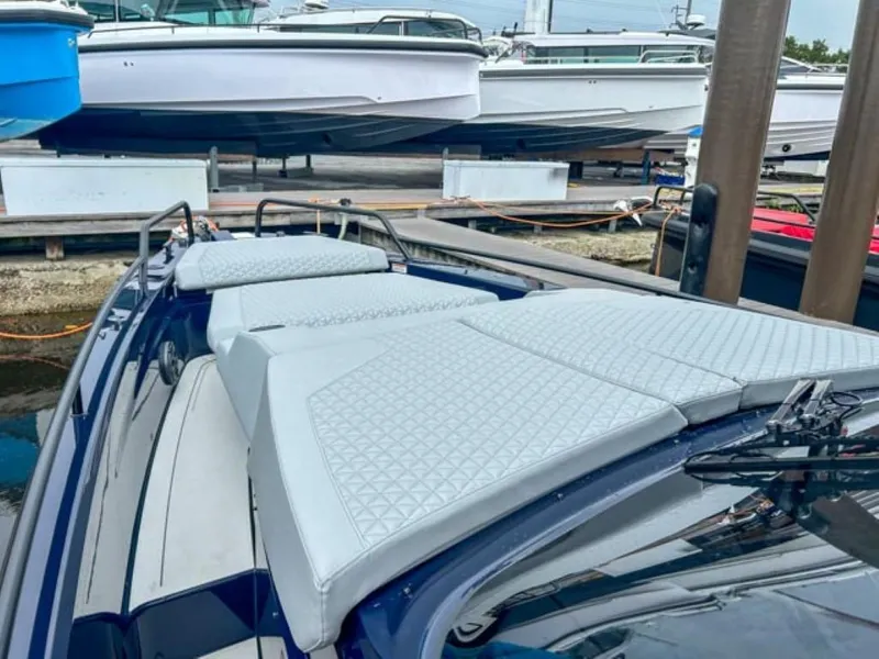 Slide: The Image of 2024 BRABUS Shadow 1000 ST luxury boat with cushioned deck at marina. - 26