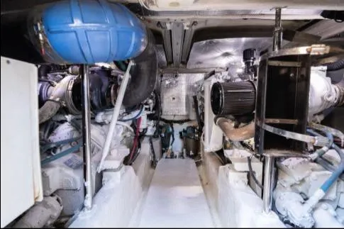 Slide: The Image of Engine room of 2005 Sea Ray 420 Sedan Bridge, showcasing mechanical components and systems. - 21