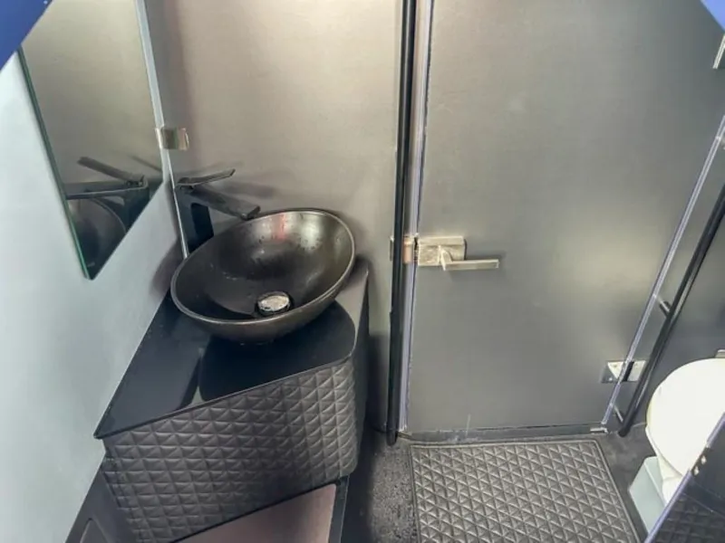 Slide: The Image of 2024 BRABUS Shadow 1000 ST bathroom with modern black sink and sleek design. - 15