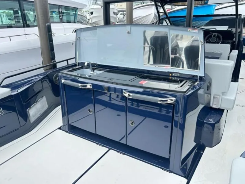 Slide: The Image of 2024 BRABUS Shadow 1000 ST yacht interior with sleek blue cabinetry. - 21