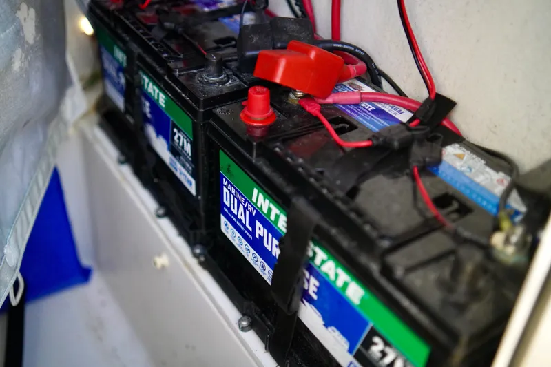 Slide: The Image of Marine batteries in a 2020 Key West 203 FS boat, featuring Interstate dual-purpose design. - 16