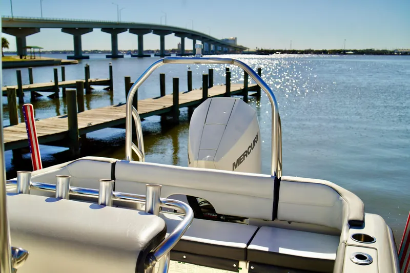 Slide: The Image of 2020 Key West 203 FS boat with Mercury engine docked near a bridge on a sunny day. - 17