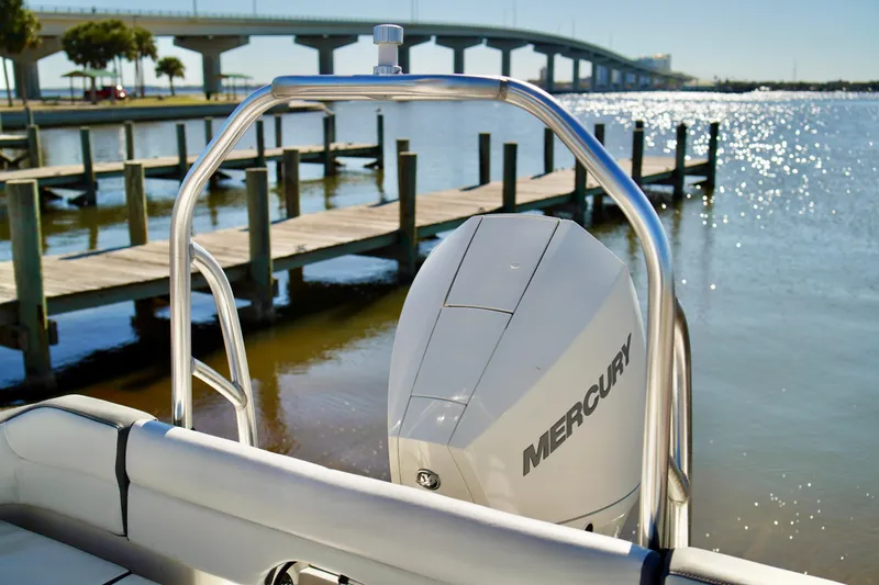 Slide: The Image of 2020 Key West 203 FS boat with Mercury engine by a sunny dock. - 18