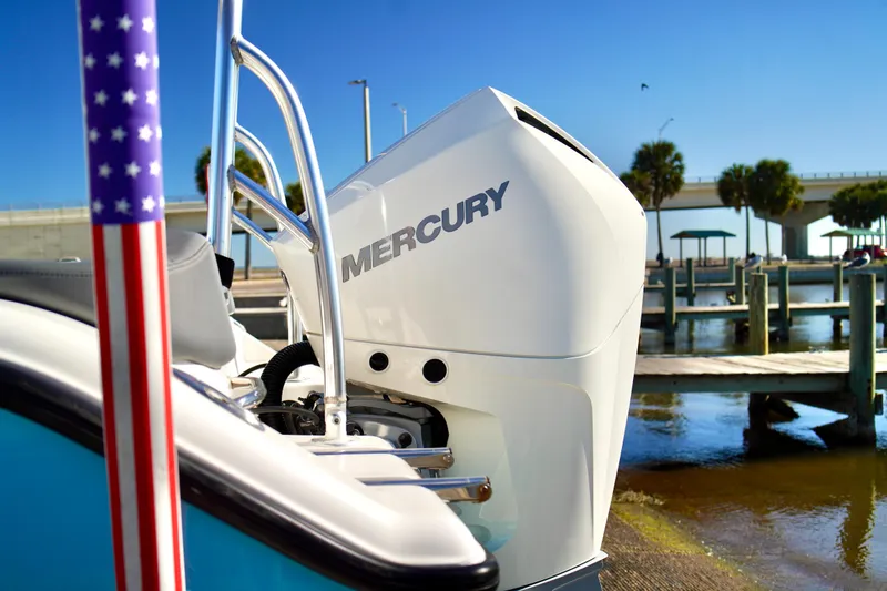 Slide: The Image of 2020 Key West 203 FS boat with Mercury engine at a sunny marina. - 23