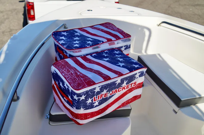 Slide: The Image of American flag-themed life jacket bags on 2020 Key West 203 FS boat. - 7