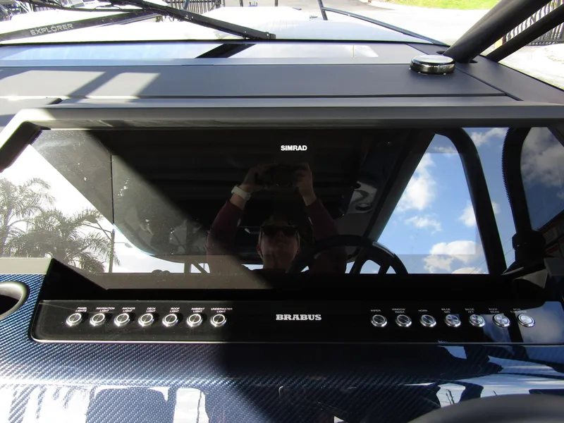 Slide: The Image of 2024 BRABUS Shadow 900 ST dashboard with sleek controls and reflective display. - 12