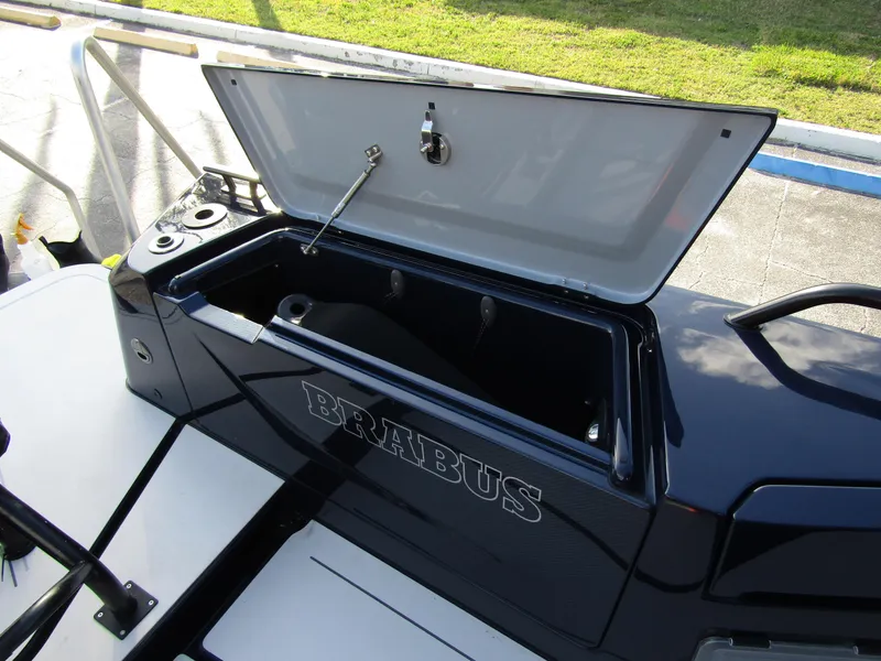 Slide: The Image of 2024 BRABUS Shadow 900 ST boat storage compartment open, showcasing sleek design. - 23