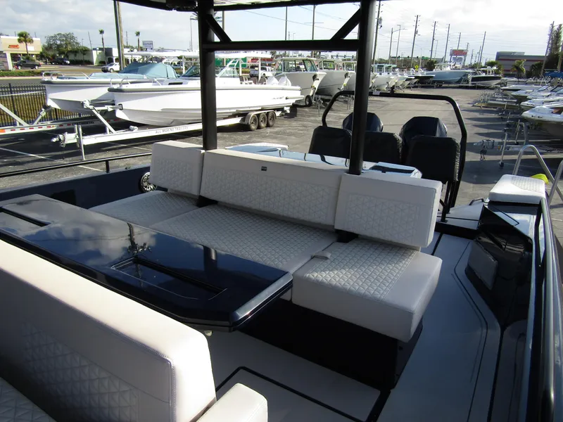 Slide: The Image of 2024 BRABUS Shadow 900 ST luxury boat interior with sleek seating and modern design. - 21