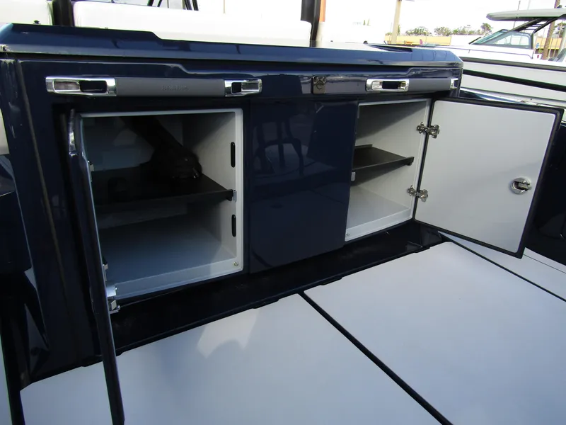 Slide: The Image of 2024 BRABUS Shadow 900 ST interior storage compartments with open doors. - 29