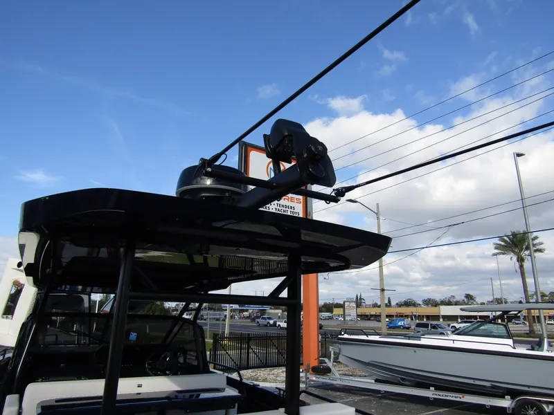 Slide: The Image of 2024 BRABUS Shadow 900 ST boat with radar equipment, docked under a partly cloudy sky. - 30