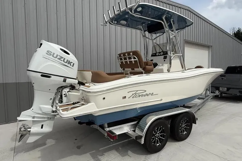 Slide: The Image of 2026 Pioneer 202 Islander boat with Suzuki outboard motor on a trailer. - 3