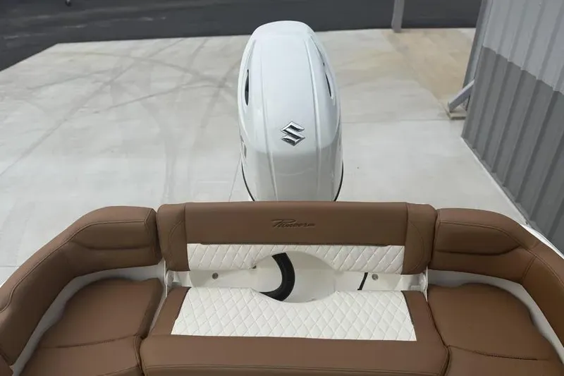 Slide: The Image of 2026 Pioneer 202 Islander boat with brown and white seating, Suzuki outboard motor. - 6