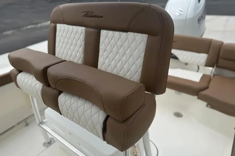 Slide: The Image of 2026 Pioneer 202 Islander boat with brown and white cushioned seating. - 8