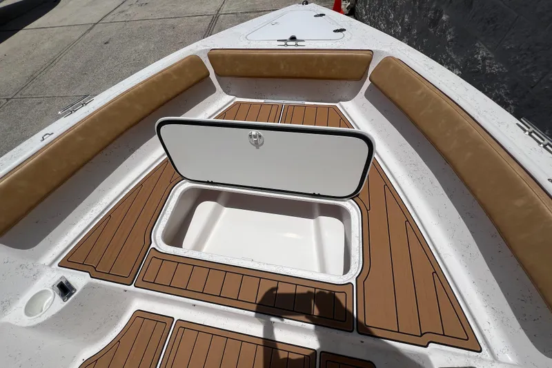 Slide: The Image of ALK2 Powerboats 18 CRS 2024 with open storage compartment and wood flooring. - 10