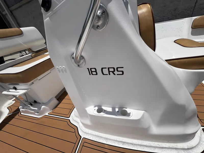 Slide: The Image of ALK2 Powerboats 18 CRS 2024 with brown seats and white helm. - 11