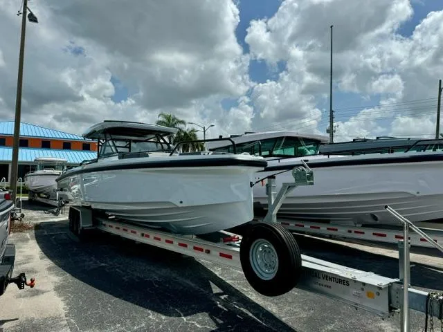 The Image of 2024 BRABUS Shadow 1000 ST boat on trailer under cloudy sky. - 1