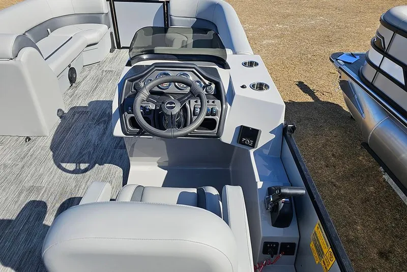 Slide: The Image of 2026 Bentley Pontoons Legacy 243 Swingback interior with steering console and seating. - 11