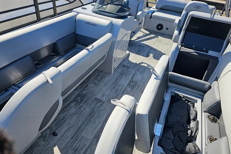 Slide: The Image of 2026 Bentley Pontoons Legacy 243 Swingback interior with luxurious seating and modern design. - 16