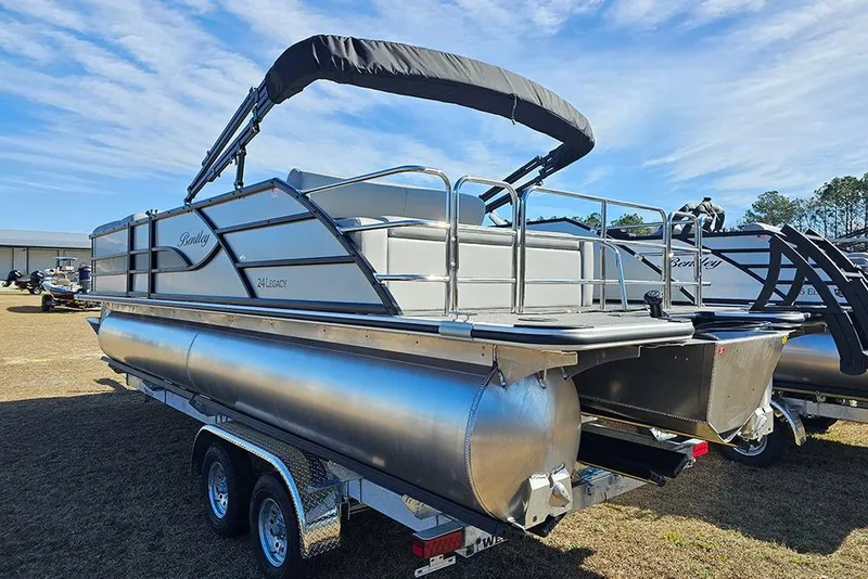 Slide: The Image of 2026 Bentley Pontoons Legacy 243 Swingback on trailer, showcasing sleek design and modern features. - 5