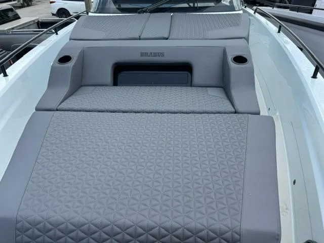 Slide: The Image of 2024 BRABUS Shadow 1000 ST boat with luxurious gray seating and sleek design. - 14