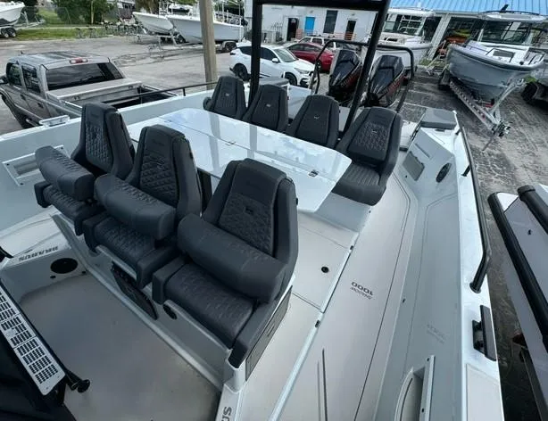 Slide: The Image of 2024 BRABUS Shadow 1000 ST luxury boat interior with sleek seating and modern design. - 8