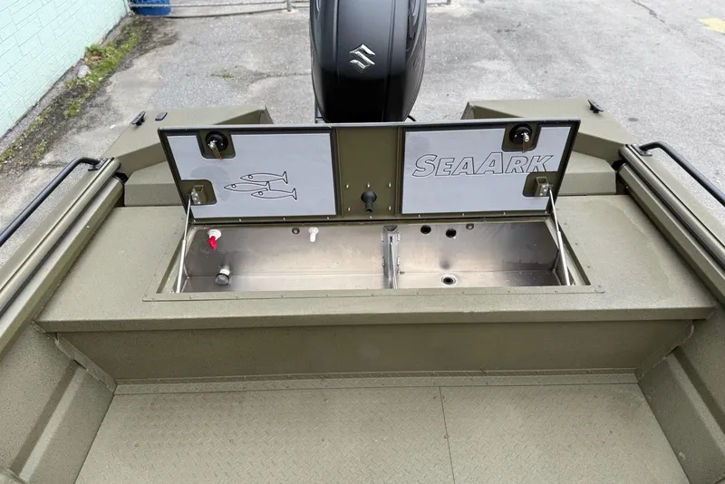 Slide: The Image of 2026 SeaArk Protege 200 boat with open storage compartment, showcasing durable design. - 11
