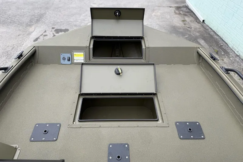 Slide: The Image of 2026 SeaArk Protege 200 boat deck with open storage compartments. - 12