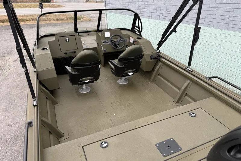 Slide: The Image of 2026 SeaArk Protege 200 boat interior with dual seats and steering console. - 6