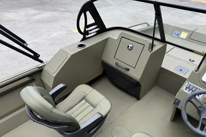 Slide: The Image of 2026 SeaArk Protege 200 boat interior with seating and control panel. - 8