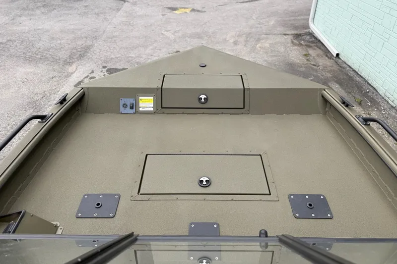 Slide: The Image of 2026 SeaArk Protege 200 boat deck with storage compartments and durable surface. - 9