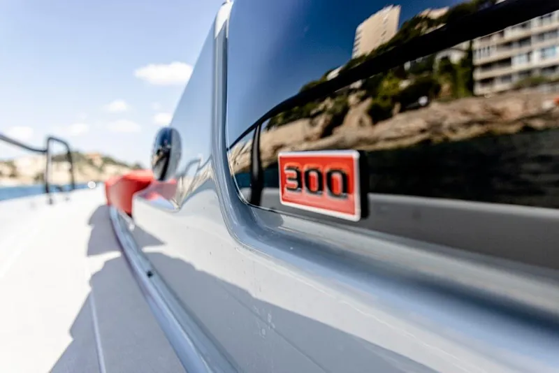 Slide: The Image of 2024 BRABUS SHADOW 300 CT boat with sleek design and red 300 emblem. - 13