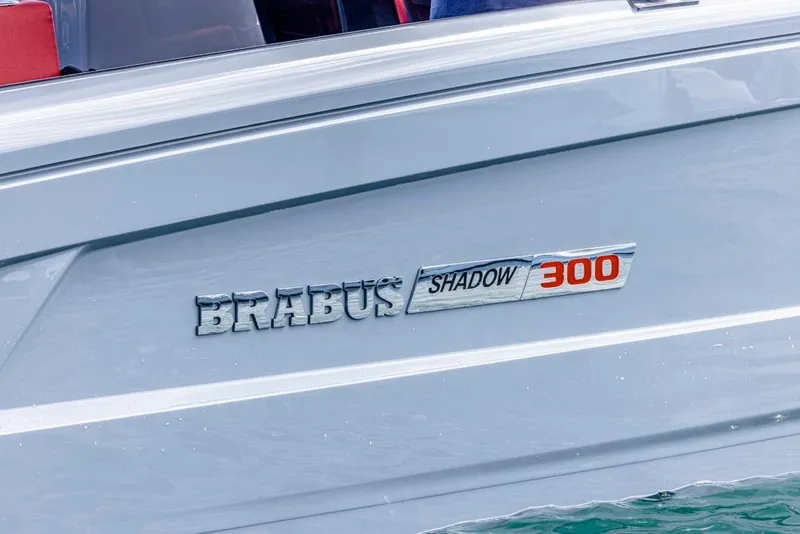 Slide: The Image of 2024 BRABUS SHADOW 300 CT boat logo on sleek silver hull. - 14