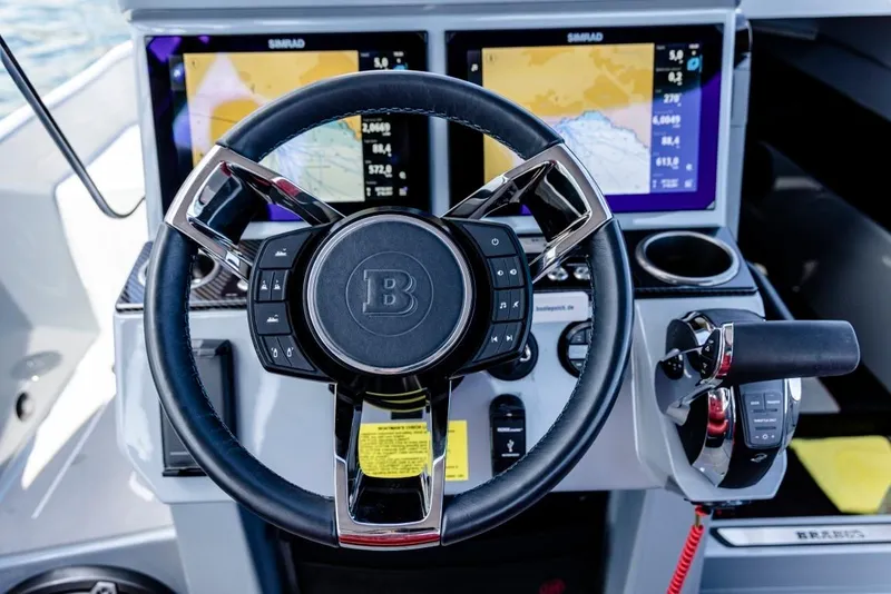 Slide: The Image of Steering wheel and controls of 2024 BRABUS SHADOW 300 CT boat cockpit. - 11