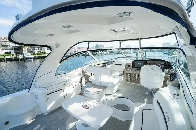 Slide: The Image of Luxurious 2005 Sea Ray 500 Sundancer yacht interior with elegant seating and modern dashboard. - 14