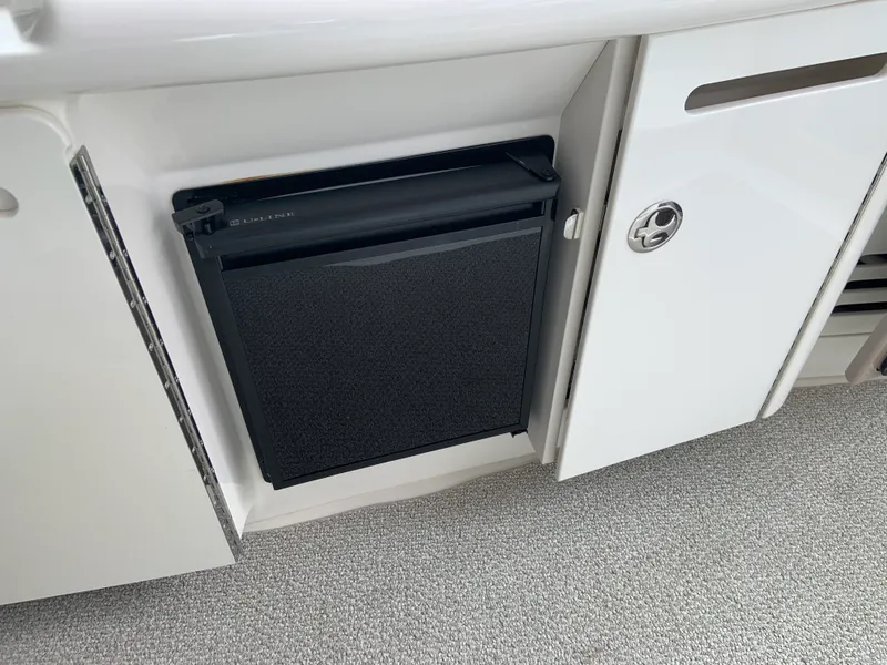 Slide: The Image of 2005 Sea Ray 500 Sundancer interior with built-in U-Line refrigerator. - 16