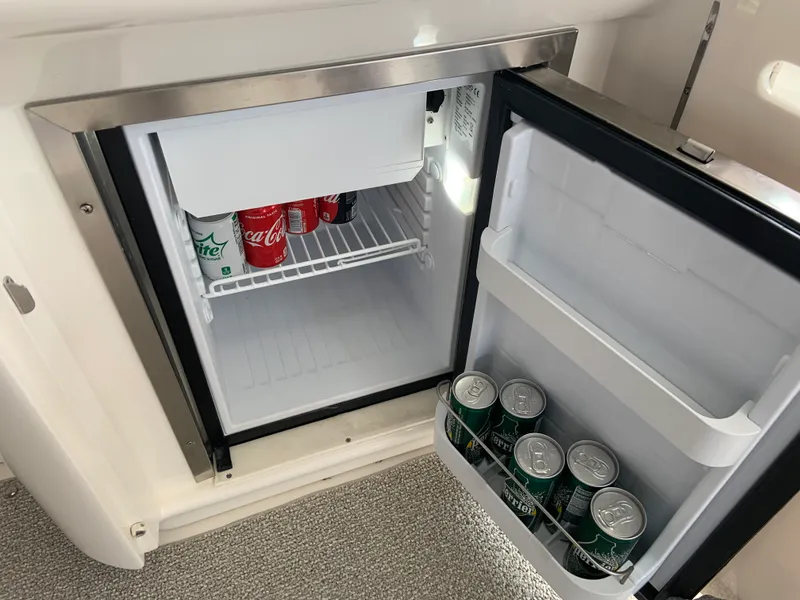 Slide: The Image of Mini fridge stocked with beverages on a 2005 Sea Ray 500 Sundancer yacht. - 18