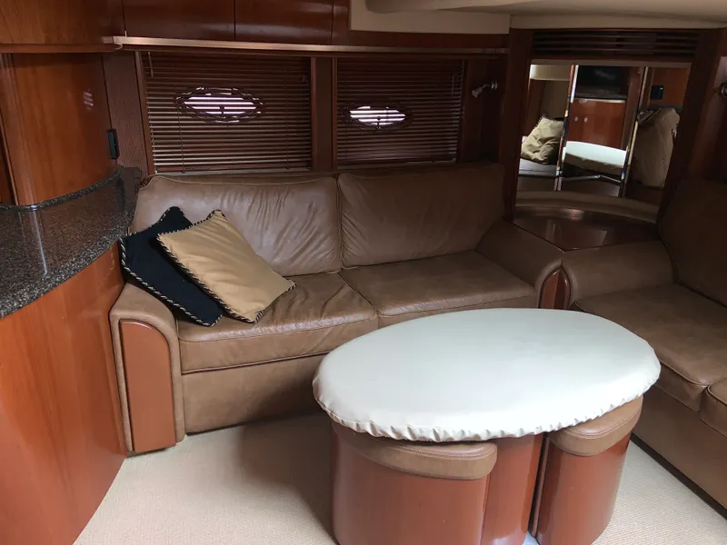 Slide: The Image of Luxurious interior of 2005 Sea Ray 500 Sundancer yacht with leather seating and oval table. - 34