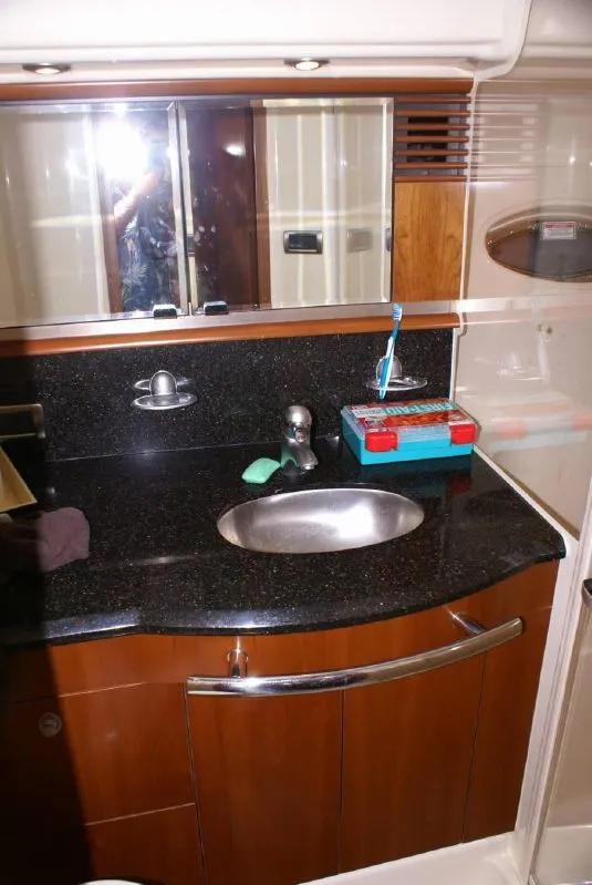 Slide: The Image of Luxurious bathroom vanity in 2005 Sea Ray 500 Sundancer yacht, featuring sleek design and modern fixtures. - 44