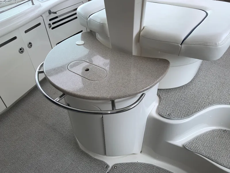 Slide: The Image of Interior of 2005 Sea Ray 500 Sundancer yacht with sleek seating and countertop design. - 9