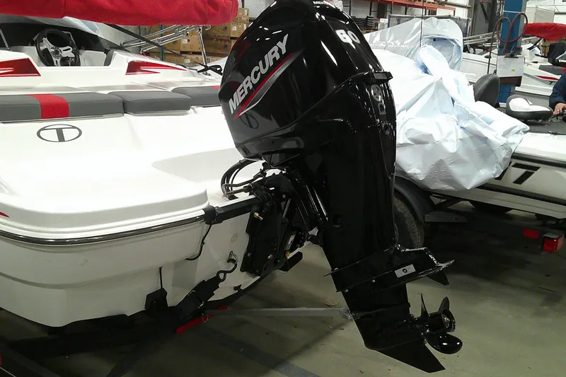 Slide: The Image of 2024 Tahoe T16 boat with Mercury outboard motor in a showroom. - 14