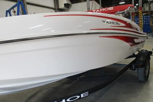 Slide: The Image of 2024 Tahoe T16 boat with sleek white and red design on a trailer. - 2