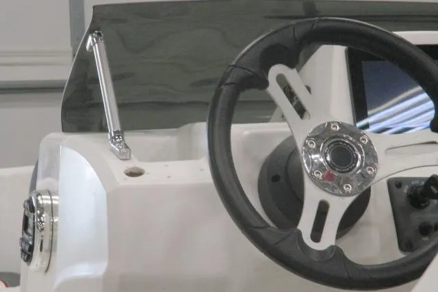 Slide: The Image of 2024 Tahoe T16 boat steering wheel and dashboard close-up. - 6