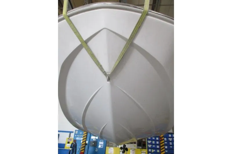 Slide: The Image of 2024 Tahoe T16 boat hull suspended in a workshop setting. - 7