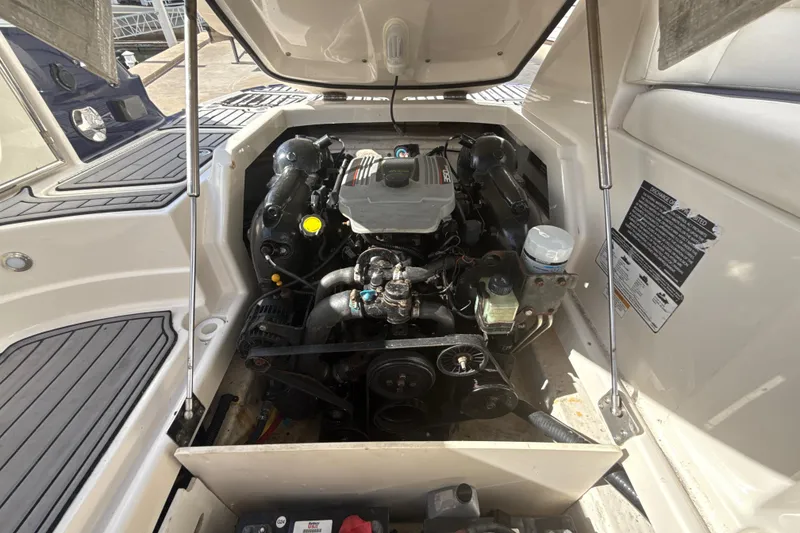 Slide: The Image of Engine compartment of a 2013 Monterey 264FS boat, showcasing detailed mechanical components. - 17