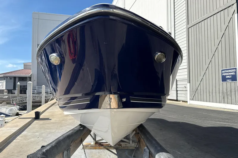 Slide: The Image of 2013 Monterey 264FS boat on trailer at marina, front view. - 21