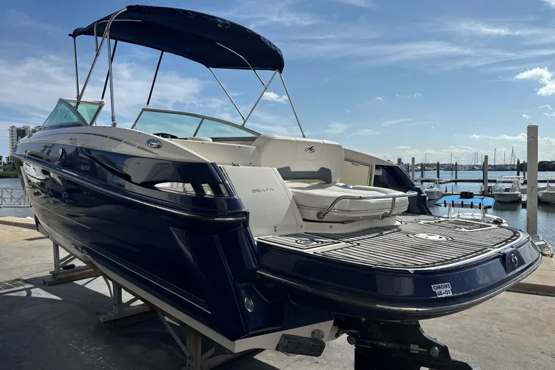 Slide: The Image of 2013 Monterey 264FS boat docked, featuring sleek design and spacious seating. - 3