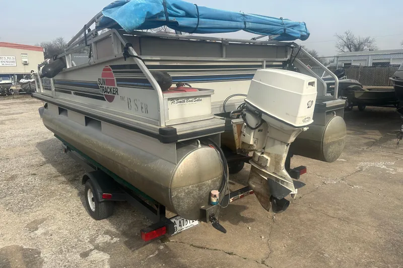 Slide: The Image of 1992 Sun Tracker Bass Buggy 18 Classic Series pontoon boat with outboard motor on trailer. - 3