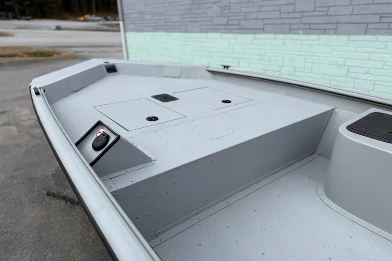 Slide: The Image of 2026 SeaArk Shadow 187 boat interior with storage compartments and sleek design. - 4